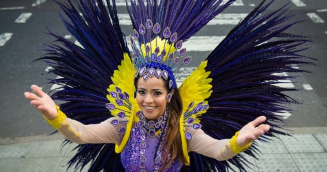 Pilates instructor Juliana Campos wearing a Brazilian made carnival costume, ahead of the Notting Hill Carnival, London.