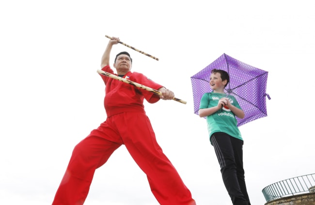 JJ doyle (11) watches Modesto llanera performing Arnis, a martial art of the Philippines, on Dún Laoghaire Pier at the launch of the Festival of Inclusion .