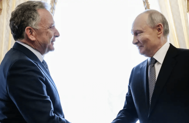 Russian President Vladimir Putin, right, greets US envoy Steve Witkoff.