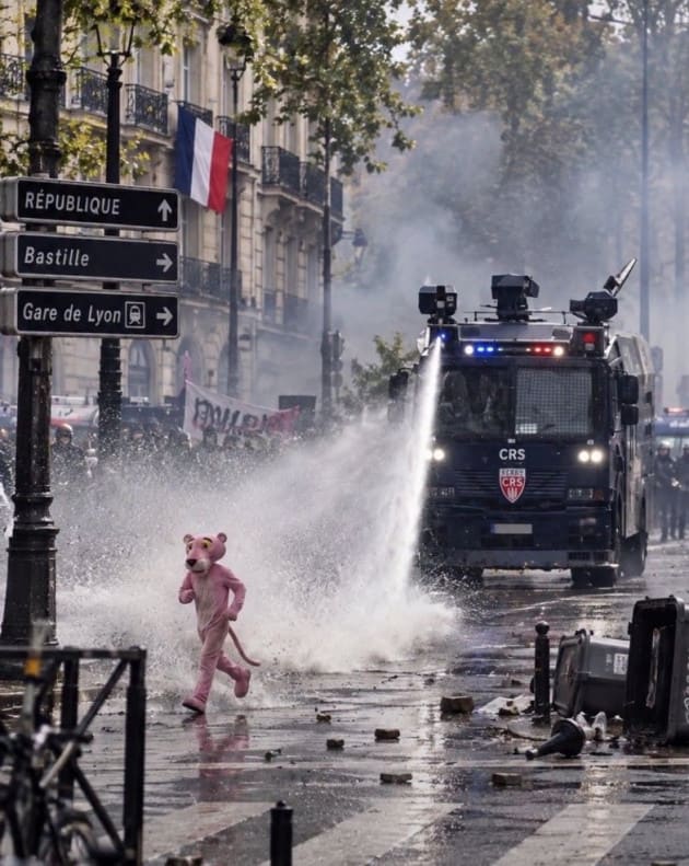 Perhaps the most popular picture spread online, showing an AI Pink Panther running from water cannons.